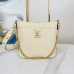 {Style No: WKSU1393} LOCK AND WALK 20 IN CREAM GRAINED CALFSKIN GOLD HARDWARE