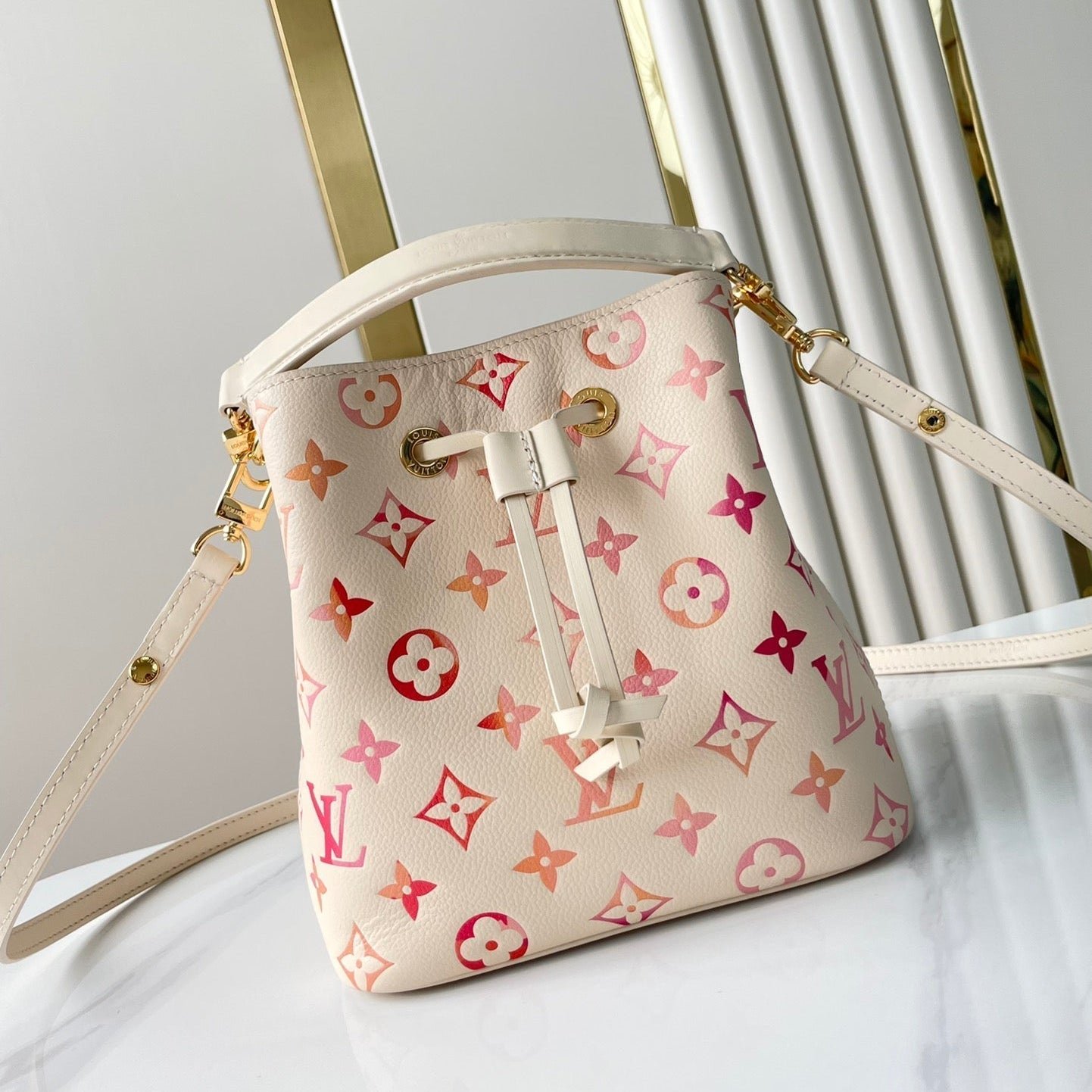 {Style No: RS3WJOC6} NÉONOÉ BB 20 IN SUNRISE AQUARELLE MONOGRAM EMPREINTE LEATHER