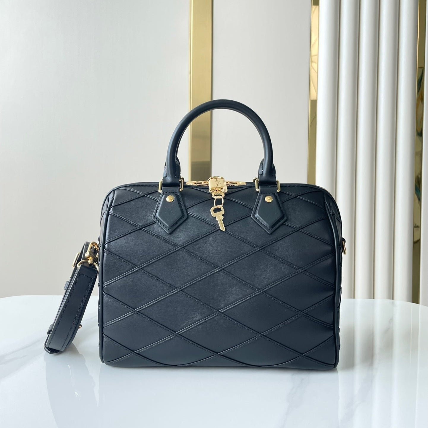 {Style No: 4OOKSP8S} SPEEDY BANDOULIÈRE 25 WITH CRISS CROSS PATTERN IN BLACK LAMBSKIN