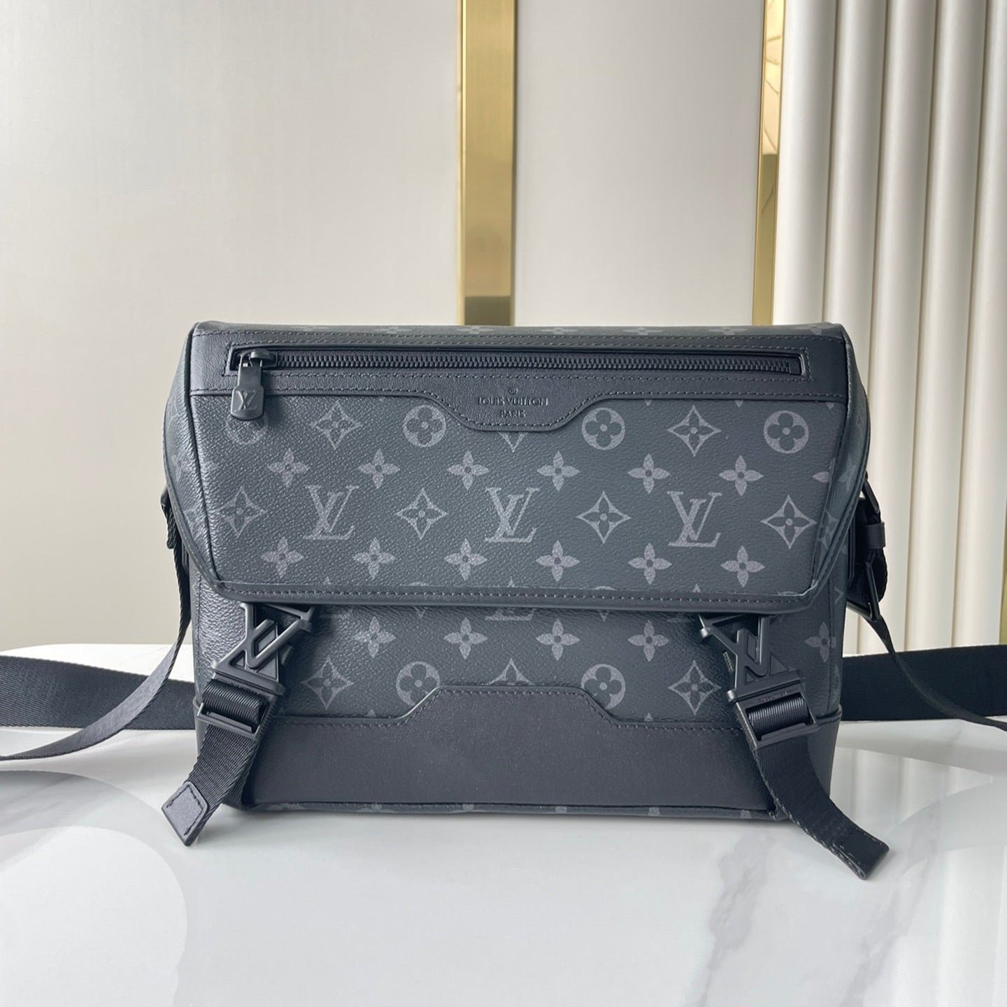 {Style No: 5N5O1G4N} MESSENGER VOYAGER PM 33 IN GUN METAL MONOGRAM ECLIPSE CANVAS