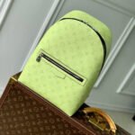 {Style No: 9BMHVVID} DISCOVERY SLIM BACKPACK 38 IN LEMON YELLOW MONOGRAM ECLIPSE REVERSE CALFSKIN