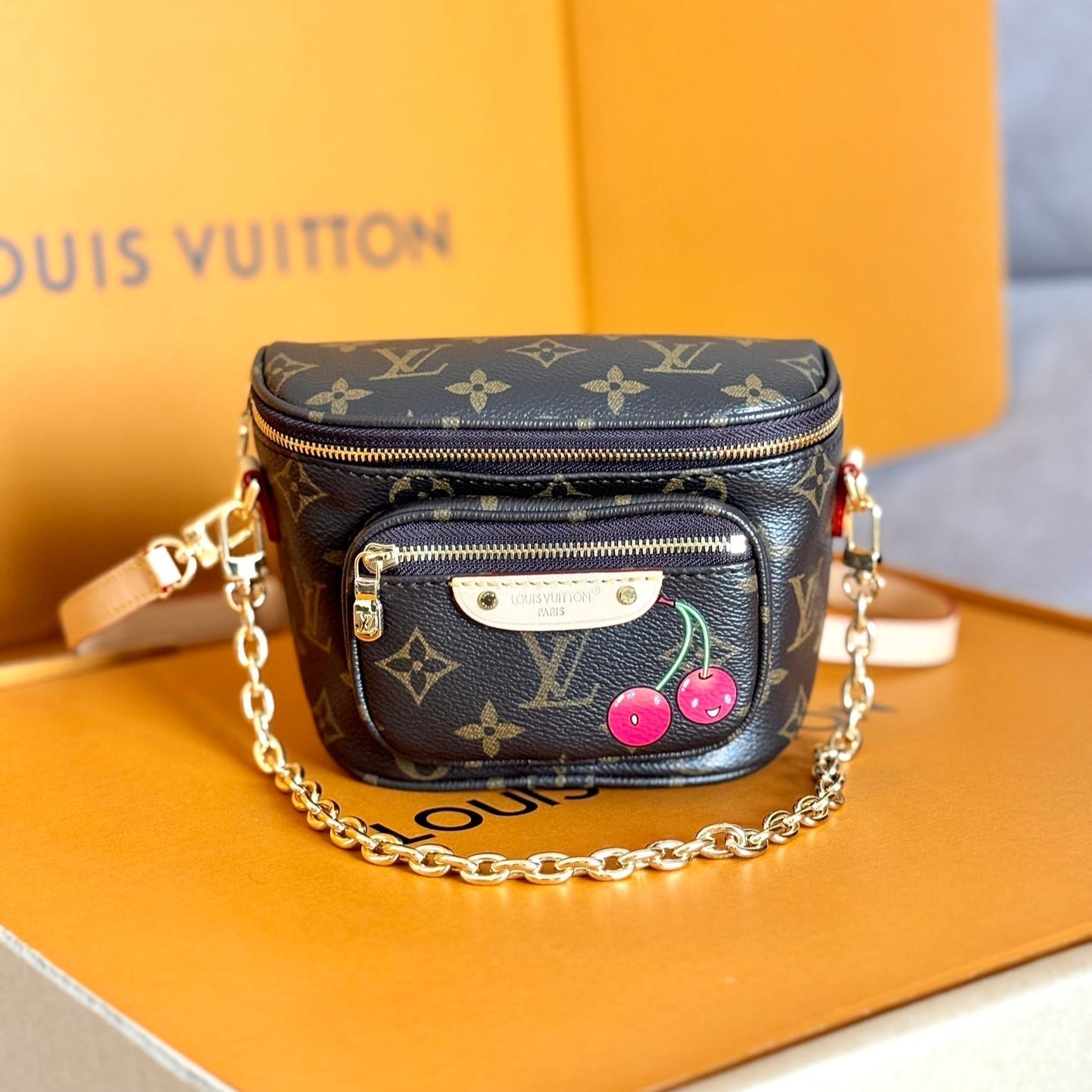 {Style No: DI5ZGY4Q} LV 25S MINI BUMBAG 17 IN BROWN CANVAS MONOGRAM CHERRY PRINT GOLD HARDWARE