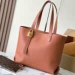 {Style No: F7FQ3TAU} LOW KEY CABAS 47 IN SASSY SALMON GRAINED CALFSKIN GOLD BUCKLE