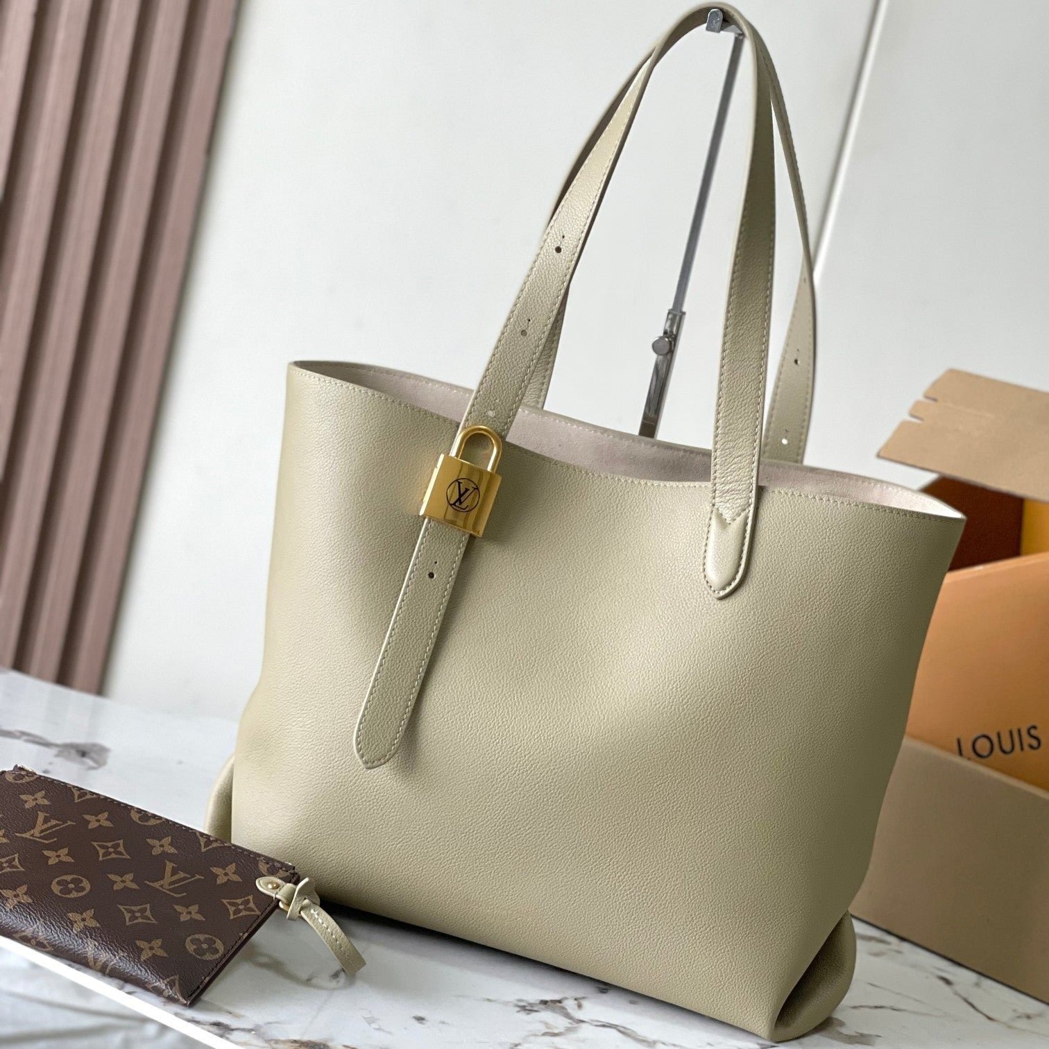 {Style No: NJQCCASL} LOW KEY CABAS 47 IN BEIGE GRAINED CALFSKIN GOLD BUCKLE