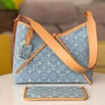 {Style No: 42GBMYP1} LV 25S CARRYALL 29 IN LIGHT BLUE DENIM MONOGRAM LEATHER TRIM