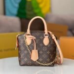 {Style No: Y72F6LZ8} LV 25S LOCKIT BB 19 IN BROWN MONOGRAM COATED CANVAS GOLD HARDWARE