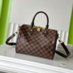 {Style No: UEH72CW6} SPEEDY BANDOLIÈRE 25 IN DARK BROWN DAMIER EBENE CANVAS GOLD HARDWARE