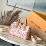 {Style No: VALIWFHA} SPEEDY BANDOULIÈRE 20 IN CORAL MONOGRAM TILES CANVAS GOLD BUCKLE