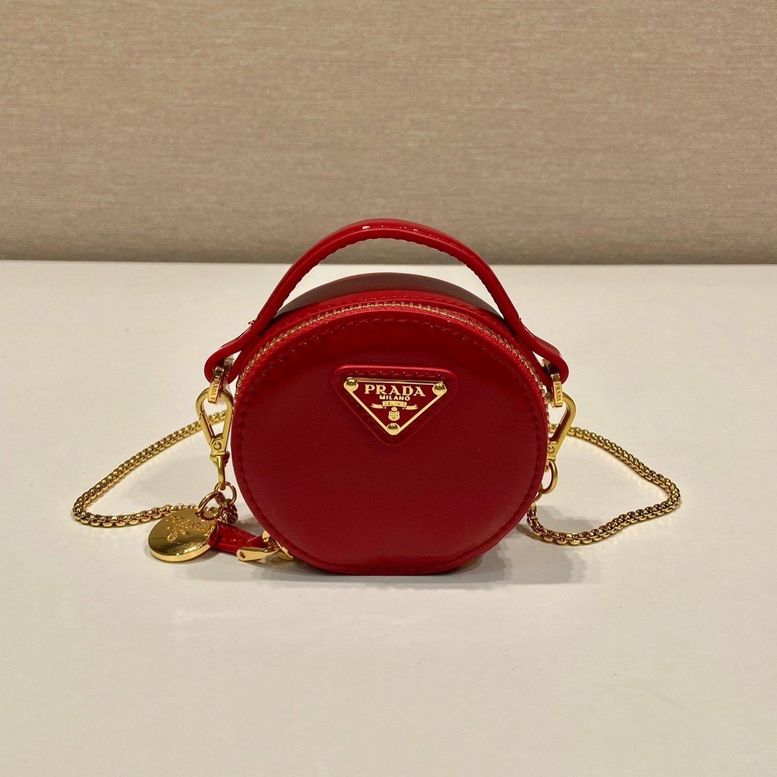 {Style No: BZX24P2Q} MINI ROUND BAG 8 IN RED GLOSSY CALFSKIN GOLD HARDWARE