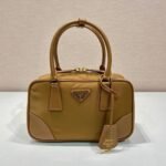 {Style No: 39DXBBLQ} SMALL TOP HANDLE BAG 25 IN GOLDEN BROWN NYLON AND CALFSKIN TRIM