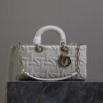 {Style No: BPDQMNJI} LADY D-JOY BAG 26 IN WHITE GRAPHIC CANNAGE CALFSKIN PALE GOLD-FINISH METAL CHARMS