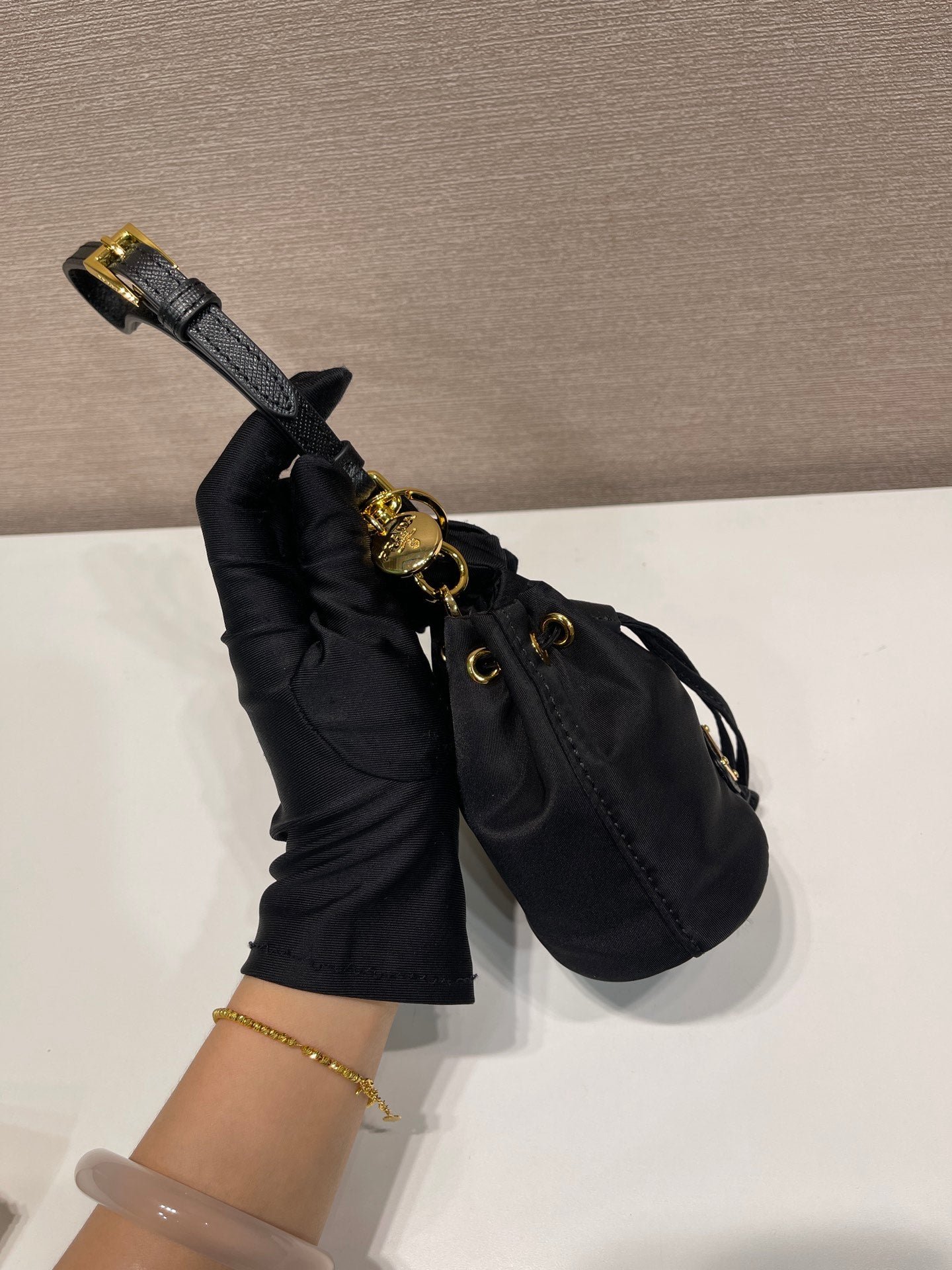 {Style No: QMC1V6OL} MINI BUCKET BAG 10 IN BLACK RE-NYLON AND SAFFIANO LEATHER STRAP - Image 3