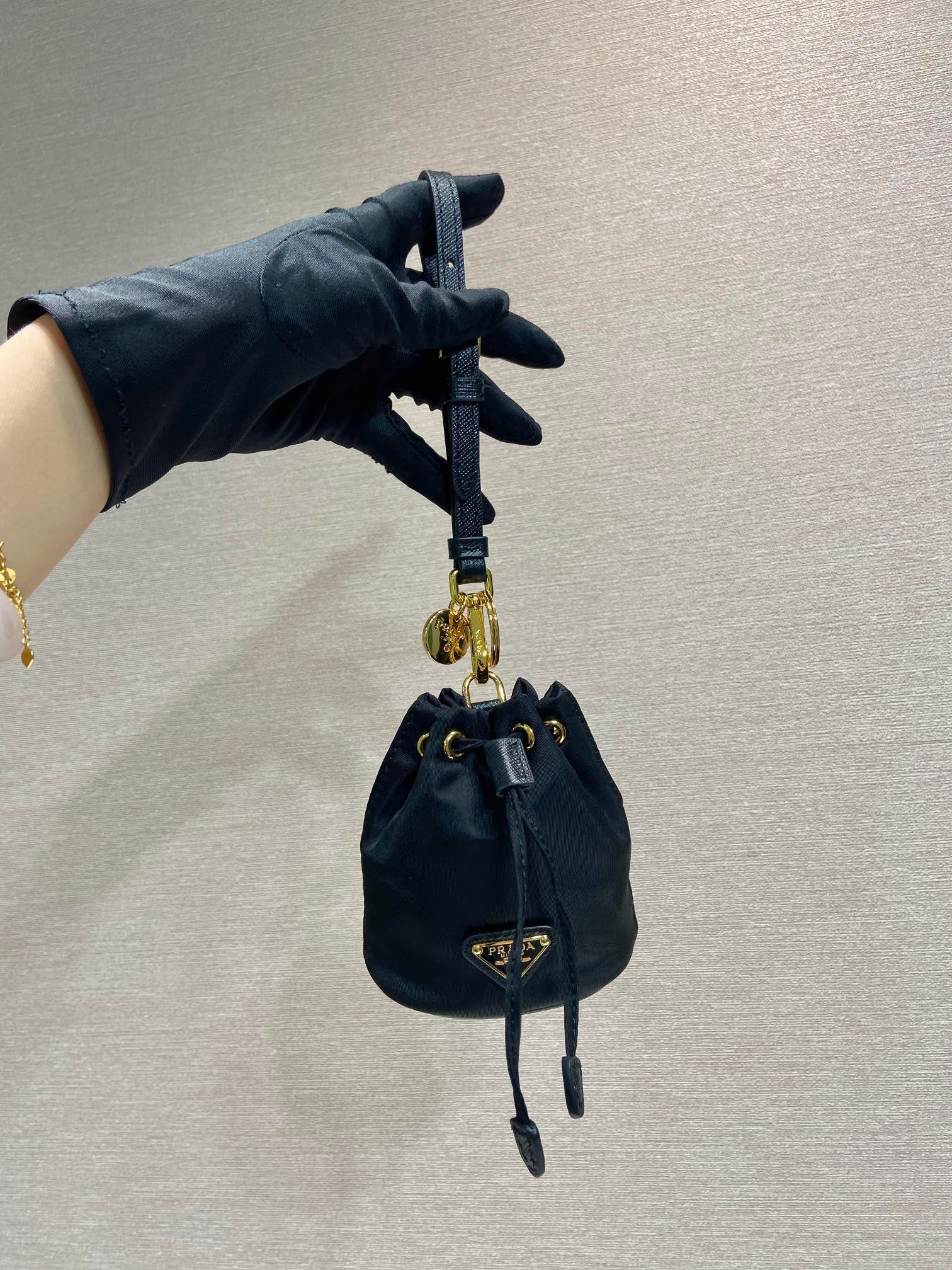 {Style No: QMC1V6OL} MINI BUCKET BAG 10 IN BLACK RE-NYLON AND SAFFIANO LEATHER STRAP - Image 4