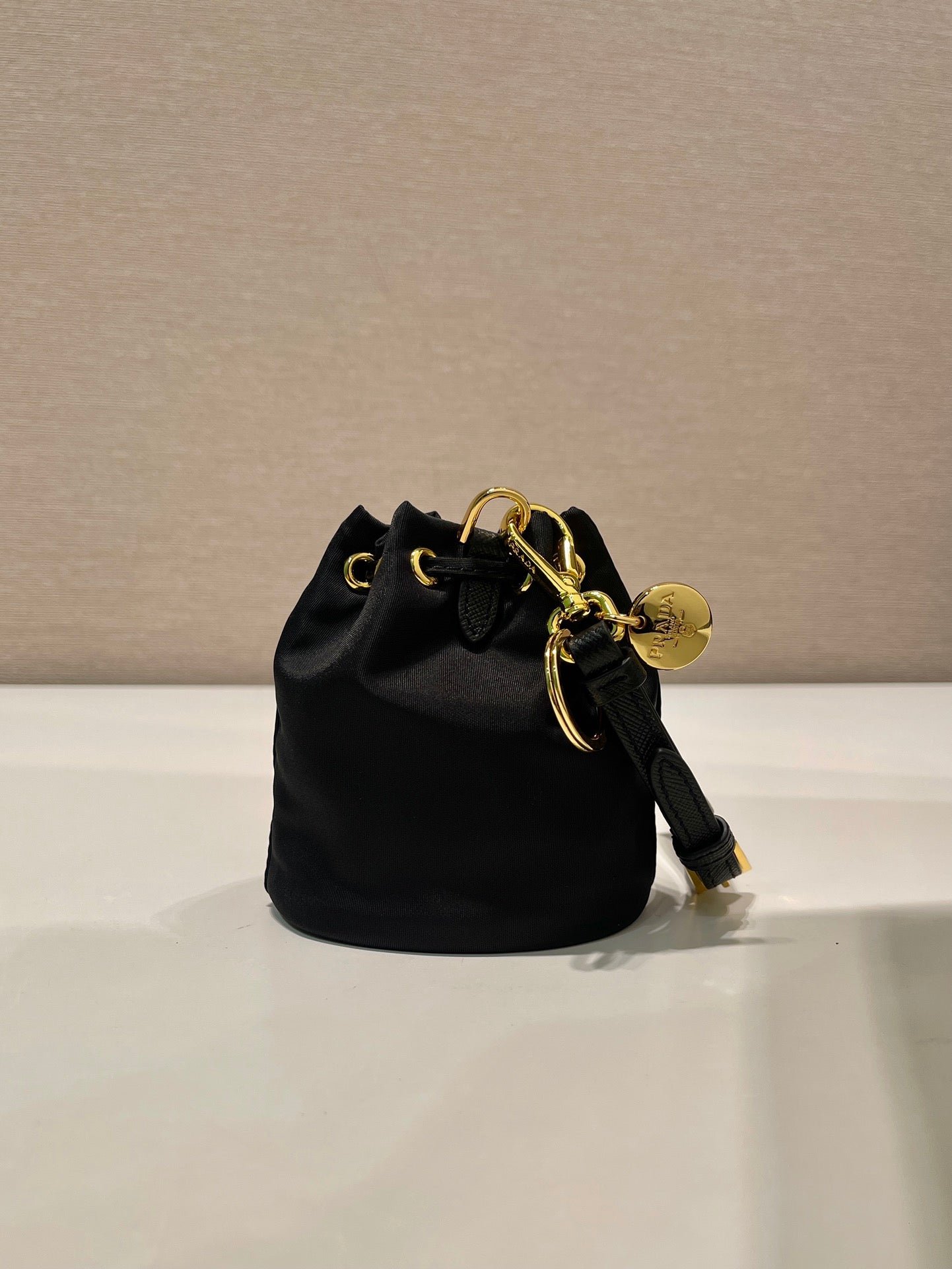 {Style No: QMC1V6OL} MINI BUCKET BAG 10 IN BLACK RE-NYLON AND SAFFIANO LEATHER STRAP - Image 7