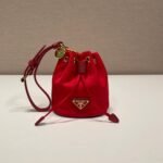 {Style No: NA4EGQUC} MINI BUCKET BAG 10 IN RED RE-NYLON AND SAFFIANO LEATHER STRAP