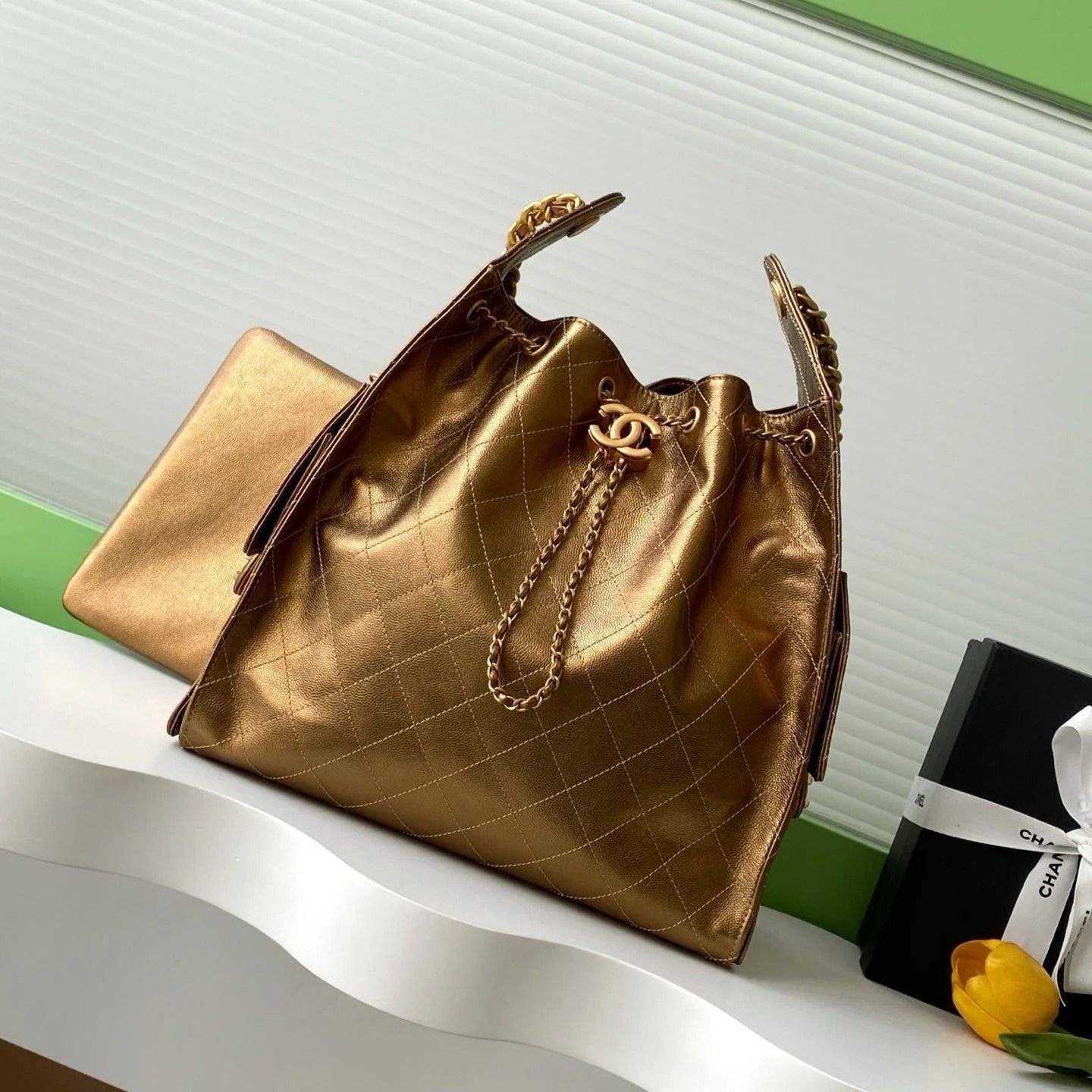 {Style No: LDSGN3HI} GABRIELLE BUCKET BAG IN METALLIC GOLD LAMBSKIN