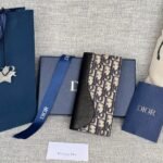 {Style No: CFAKE84F} VERTICAL BIFOLD WALLET 19 IN BLACK GRAINED CALFSKIN MIX BLUE MONOGRAM OBLIQUE JACQUARD