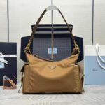 {Style No: R5WC46T9} PRADA 25S EXPLORE LARGE RE-NYLON SHOULDER BAG 32 IN BRANDY WITH FLAP