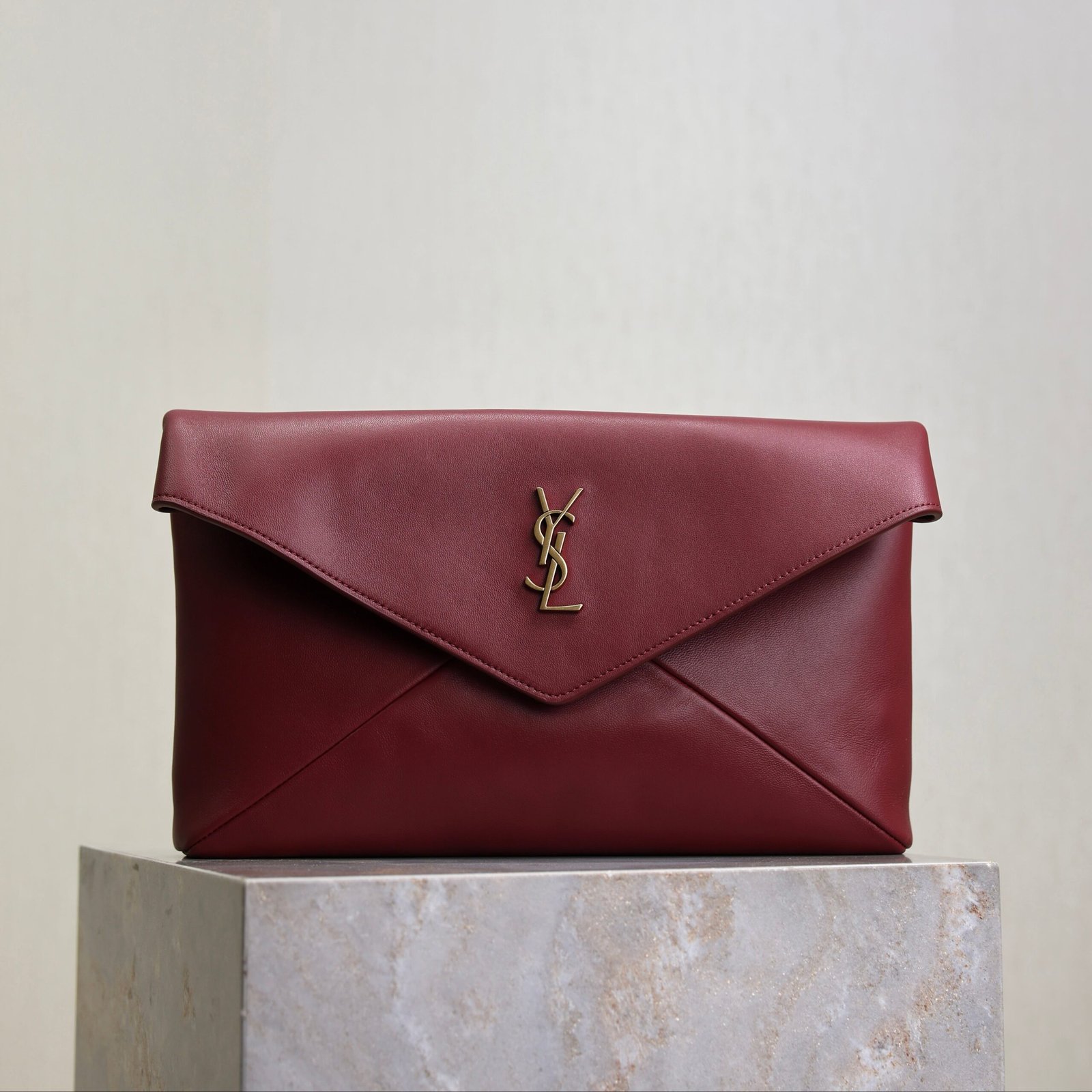 {Style No: UH9GXISL} YSL 25S CASSANDRE LARGE ENVELOPE POUCH 29 IN DARK RUBY SHINY CALFSKIN GOLD HARDWRE