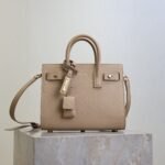 {Style No: LYC7Z4YG} YSL 25S SAC DE JOUR 22 IN DARK BEIGE SUPPLE GRAINED CALFSKIN