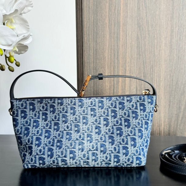 {Style No: IS6ZHTE1} TRAVEL NOMAD POUCH 22 IN BLUE MONOGRAM OBLIQUE JACQUARD