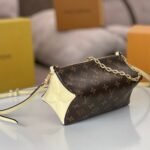 {Style No: IZLKTJ6A} BLOOM POUCH 22 IN BROWN MONOGRAM CANVAS AND PASTEL YELLOW CALFSKIN SIDES