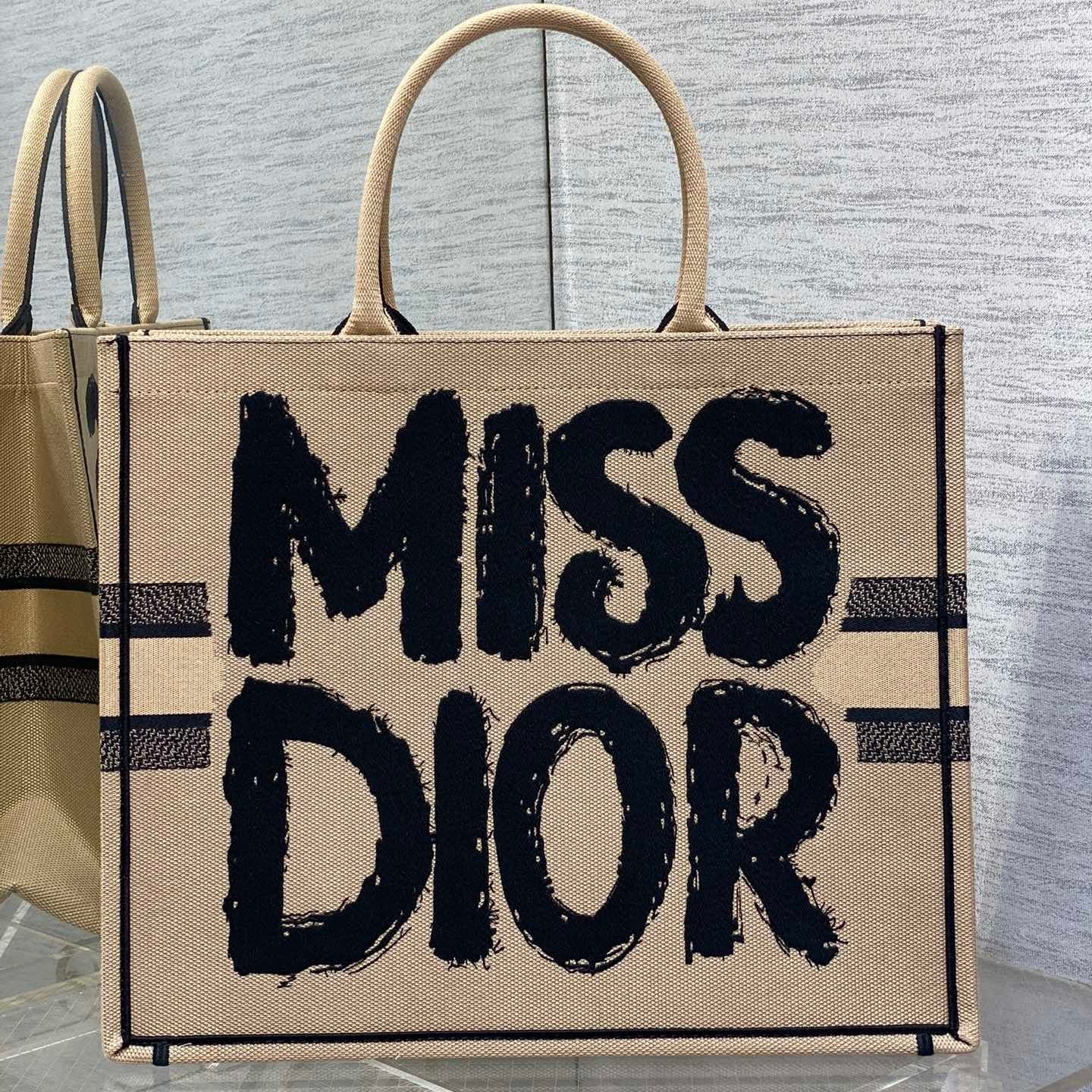 {Style No: 27UGLSNZ} LARGE BOOK TOTE 42 BEIGE AND BLACK MISS DIOR GRAFFITI EMBROIDERY