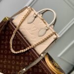 {Style No: VZ54FJWI} ONTHEGO EAST WEST BAG 25 IN BEIGE MONOGRAM EMBOSSED COWHIDE