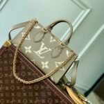 {Style No: YTURM3BR} ONTHEGO EAST WEST BAG 25 IN GREEN MONOGRAM EMBOSSED COWHIDE