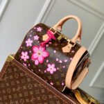 {Style No: GIKWW1V4} SPEEDY BANDOULIÈRE CHERRY BLOSSOM 25 IN SAKURA BROWN MONOGRAM COATED CANVAS