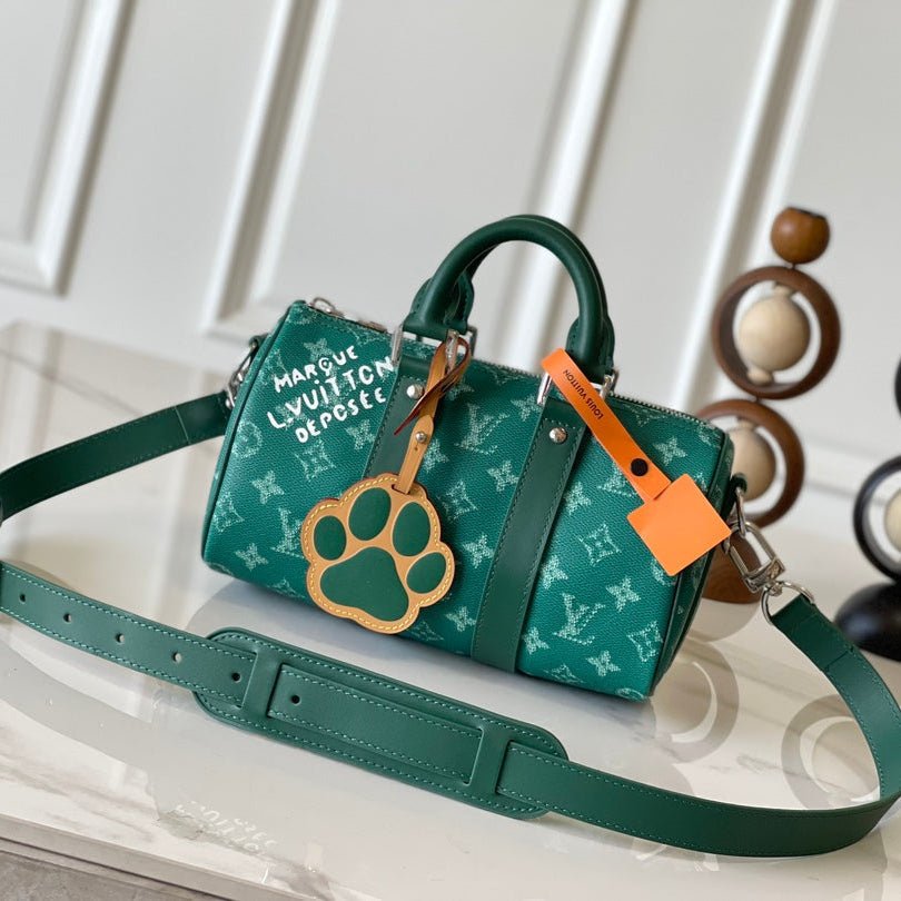 {Style No: YD6W4SJG} KEEPALL BANDOULIÈRE 25 IN GREEN MONOGRAM HERITAGE CANVAS