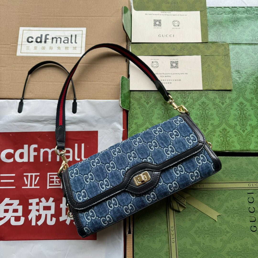 {Style No: LWYX82GV} LUCE SMALL SHOULDER BAG 27 IN BLUE EMBOSSED DENIM AND BLACK CALFSKIN TRIM GOLD HARDWARE