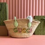 {Style No: I2159J86} SMALL TOTE BAG 26 WITH LOGO IN NATURAL-COLORED STRAW AND LIGHT GREEN CALFSKIN HANDLE