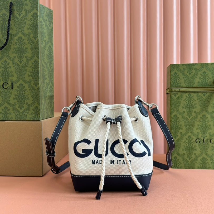 {Style No: CJ8727RU} SMALL DRAWSTRING SHOULDER BAG 21 IN WHITE CANVAS DARK BLUE CALFSKIN