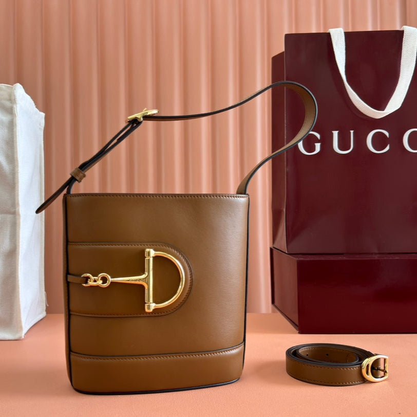 {Style No: YJ84Q6FV} 73 SMALL BUCKET BAG 20 IN BROWN SMOOTH CALFSKIN