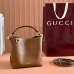 {Style No: LSMM15R4} EMBLEM SMALL BUCKET BAG 19 IN BROWN SMOOTH CALFSKIN