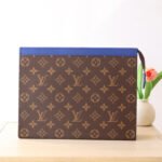 {Style No: AG7VPAIG} LV 25S POCHETTE VOYAGE 26 IN INDIGO BLUE MONOGRAM MACASSAR COATED CANVAS