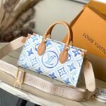 {Style No: 28QSC7K6} ONTHEGO EAST WEST 25 IN LAGOON BLUE MONOGRAM TILES CANVAS