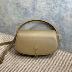 {Style No: 85F6SU4V} VOLTAIRE HALF-MOON SHOULDER BAG 24 IN CEDAR BROWN CALFSKIN GOLD METALLIC