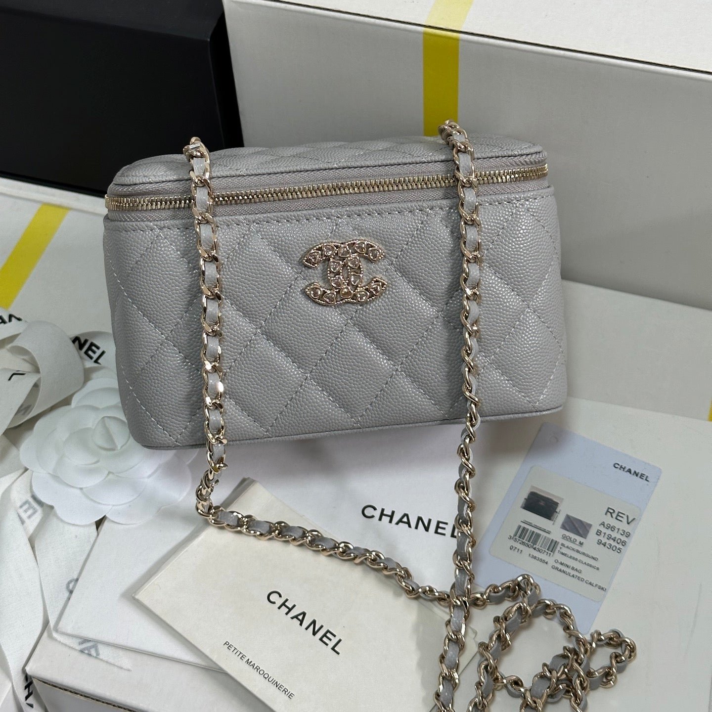 {Style No: RNL25JQL} VANITY CASE 17 CRYSTAL STUDDED LOGO IN GREY CALFSKIN GOLD HARDWARE