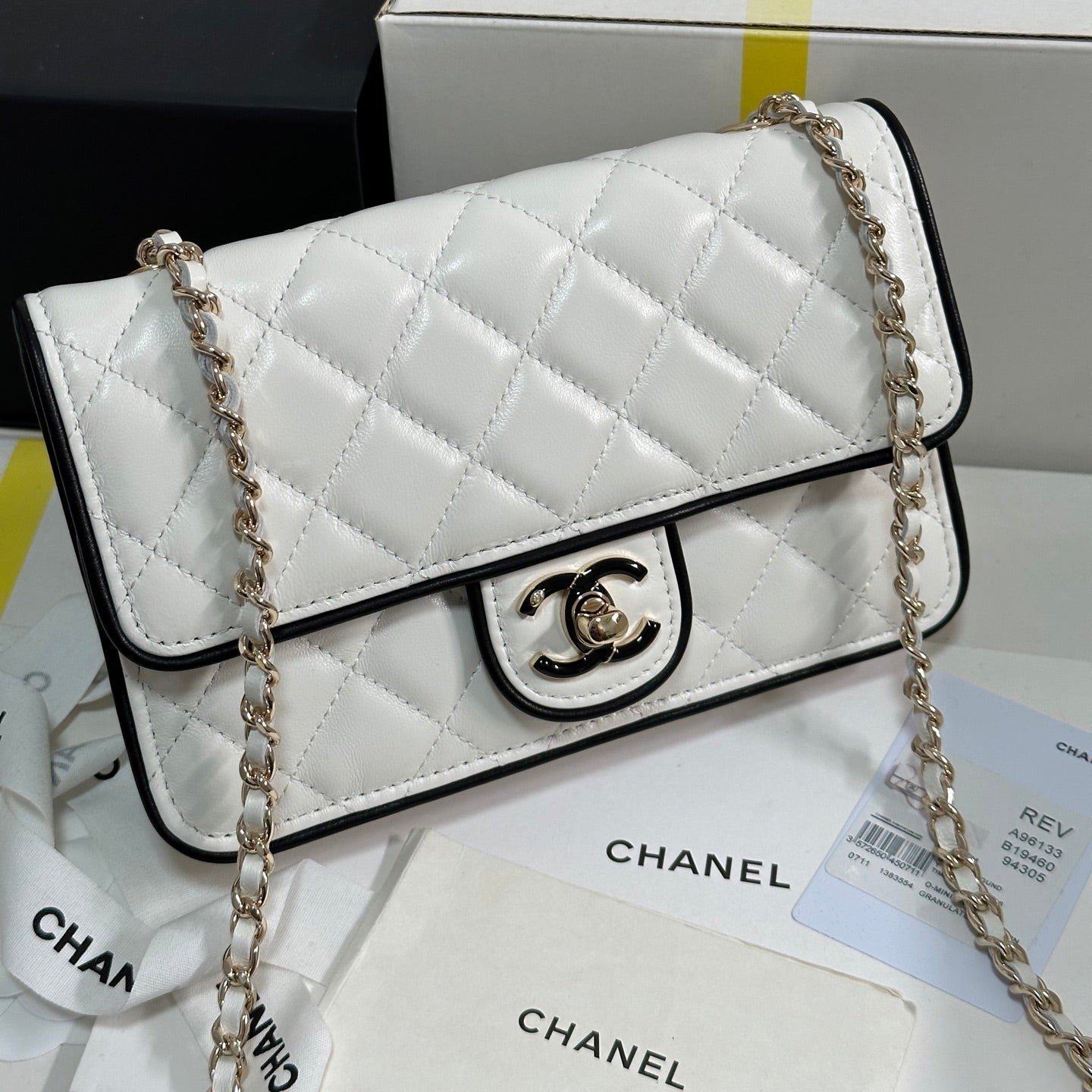 {Style No: 84C17EJ7} QUILTED FLAP BAG WITH BLACK TRIM 19 IN WHITE LAMBSKIN