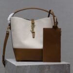 {Style No: PHFP1Q48} YSL 25S LE 5 À 7 BUCKET 26 IN CREAM BROWN CALFSKIN AND CANVAS GOLD HARDWRE