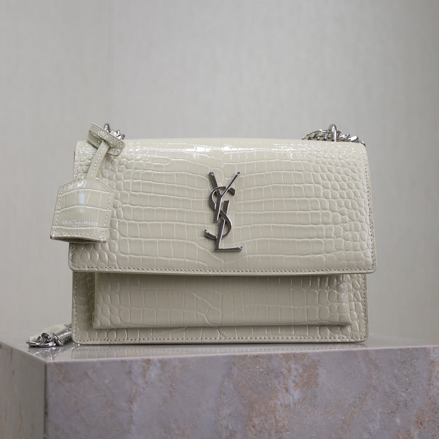 {Style No: NUYTK6XO} YSL 25S SUNSET MEDIUM 22 IN IVORY CROCODILE-EMBOSSED SHINY CALFSKIN SILVER HARDWRE